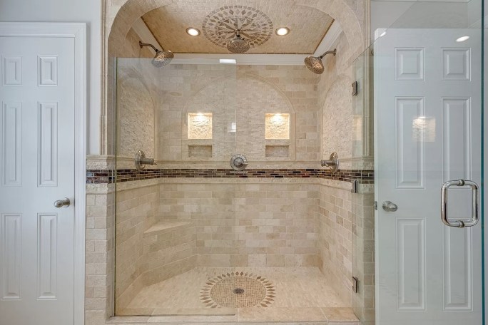 Shower tile installation, glass tile, travertine, marble travertine master bathroom remodel Schluter waterproofing systems bench. Installed in Franklin Tennessee. Serving Nashville, Brentwood, Franklin, Dickson Coun